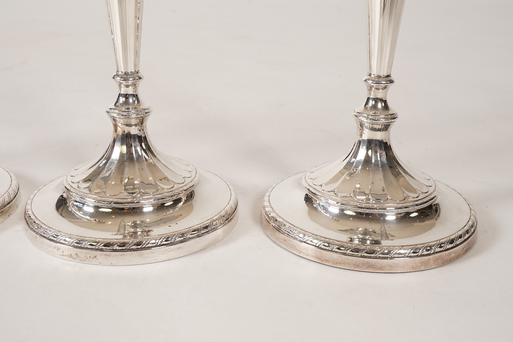 A set of four George III silver candlesticks, by John Green, Roberts, Mosley & Co